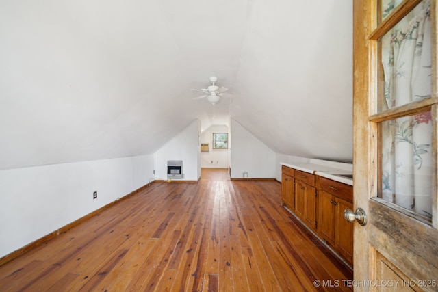 14484 Valley View Dr, Skiatook, OK 74070 - additional living space with ceiling fan, wood-type flooring, vaulted ceiling, and heating unit