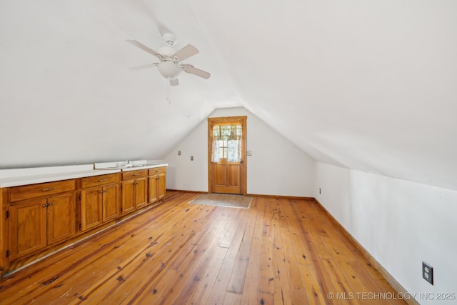 14484 Valley View Dr, Skiatook, OK 74070 - bonus room with light wood-type flooring, vaulted ceiling, and a ceiling fan