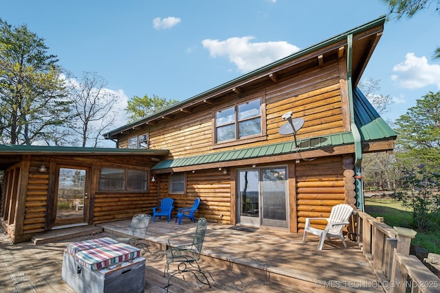 14484 Valley View Dr, Skiatook, OK 74070 - back of property with a wooden deck, log exterior, and a metal roof