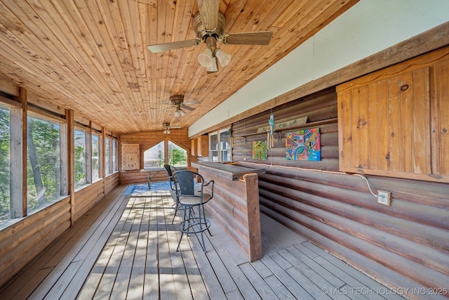 interior space with rustic walls, wooden ceiling, and wood-type flooring