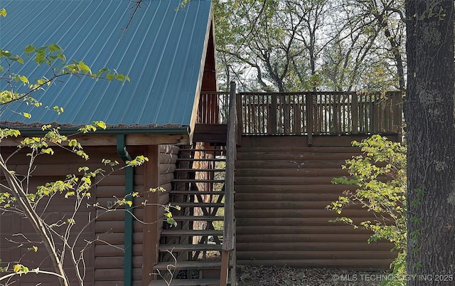 view of gate featuring stairway