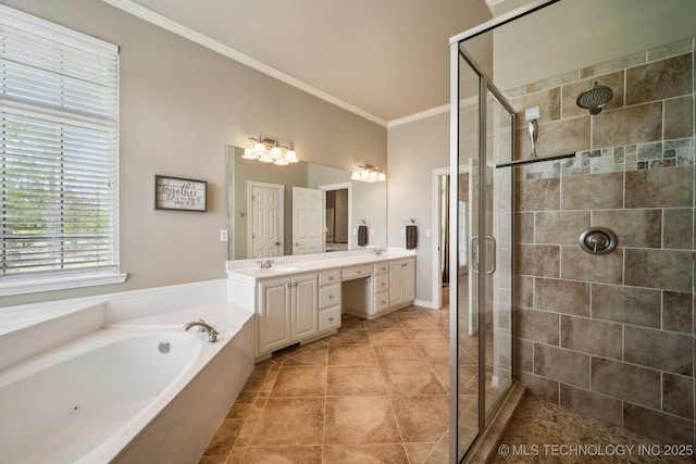 bathroom with a stall shower, a garden tub, double vanity, and ornamental molding