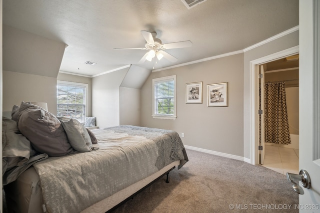carpeted bedroom with visible vents, baseboards, ornamental molding, and a ceiling fan