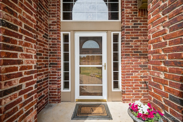 entrance to property with brick siding
