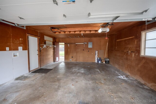 1425 S Madison Blvd, Bartlesville, OK 74006 - garage with electric panel and a garage door opener