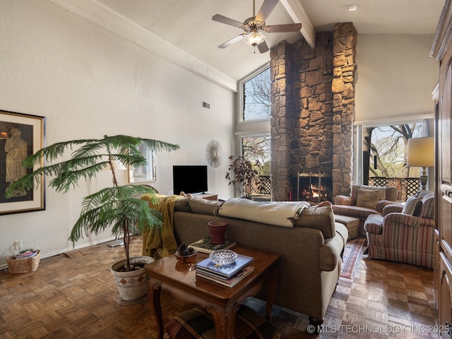 8404 S Toledo Ave, Tulsa, OK 74137 - living area featuring visible vents, a stone fireplace, a ceiling fan, beamed ceiling, and high vaulted ceiling