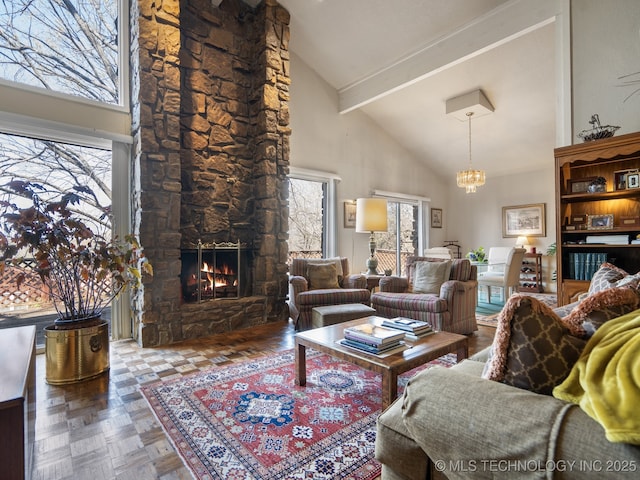 8404 S Toledo Ave, Tulsa, OK 74137 - living room with high vaulted ceiling, a notable chandelier, plenty of natural light, and a fireplace