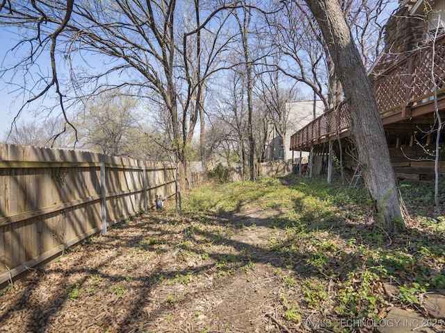 8404 S Toledo Ave, Tulsa, OK 74137 - view of yard featuring a deck and a fenced backyard