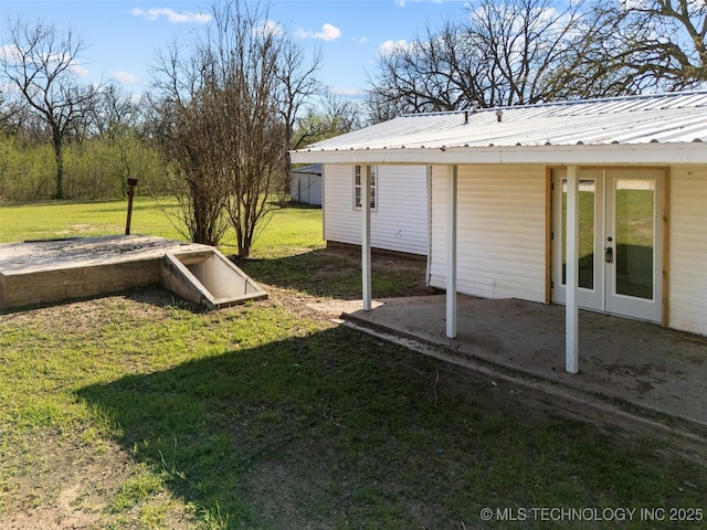 view of yard with french doors