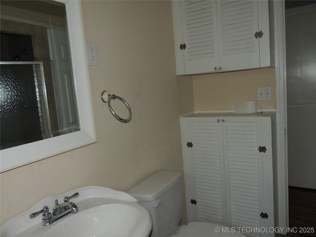 906 S 85th E Ave, Tulsa, OK 74112 - bathroom with toilet and a sink