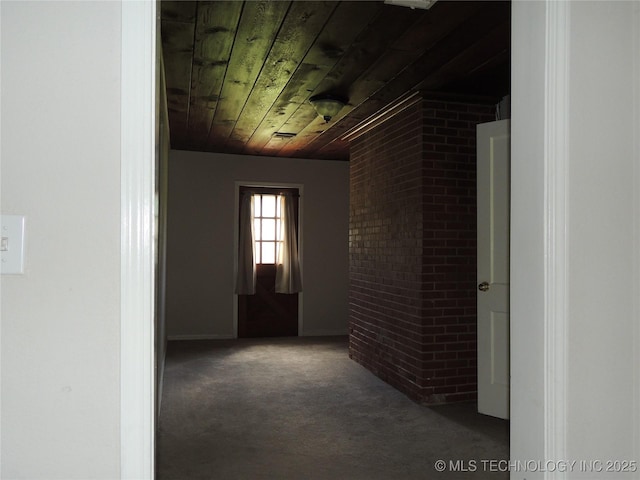 906 S 85th E Ave, Tulsa, OK 74112 - corridor with carpet, brick wall, and wooden ceiling