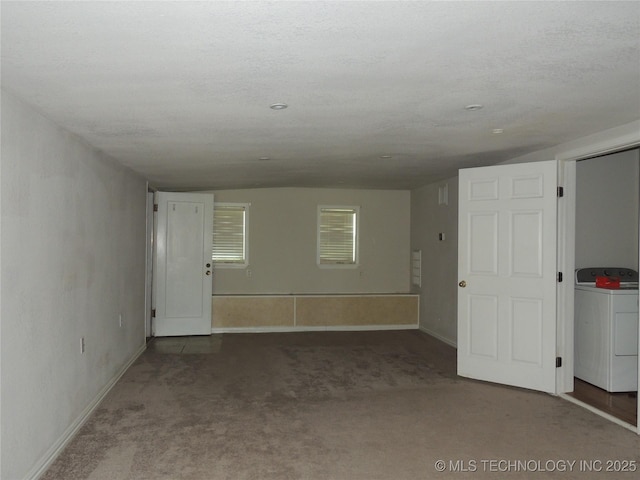906 S 85th E Ave, Tulsa, OK 74112 - carpeted empty room with baseboards, washer / dryer, and vaulted ceiling