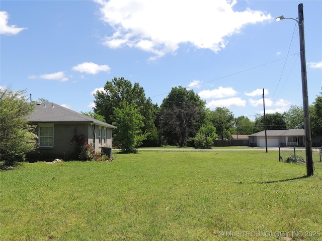 906 S 85th E Ave, Tulsa, OK 74112 - view of yard with central air condition unit and a detached garage