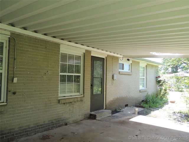 906 S 85th E Ave, Tulsa, OK 74112 - entrance to property with a patio, crawl space, and brick siding