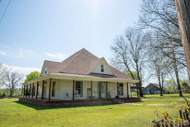 view of property exterior featuring a yard, a shingled roof, and covered porch