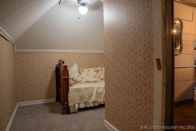 bedroom with a ceiling fan, carpet flooring, and wallpapered walls