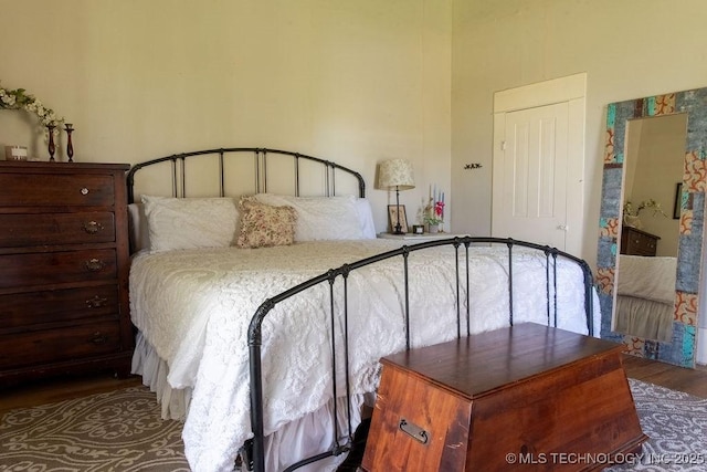 bedroom with wood finished floors
