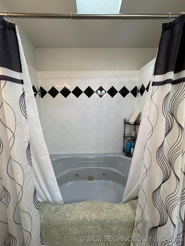 full bathroom with a combined bath / shower with jetted tub
