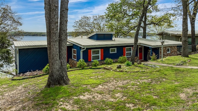 449774 E 356th Rd, Afton, OK 74331 - view of front facade featuring stone siding, a front lawn, and metal roof