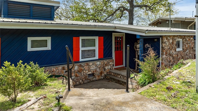 449774 E 356th Rd, Afton, OK 74331 - view of exterior entry featuring stone siding and metal roof