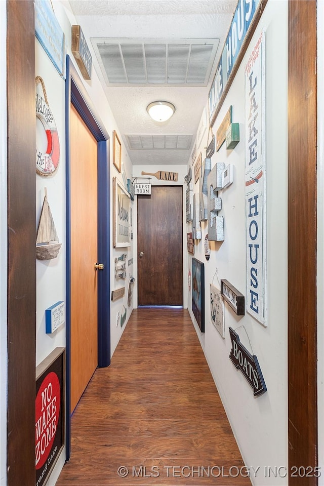 449774 E 356th Rd, Afton, OK 74331 - hallway featuring wood finished floors and visible vents