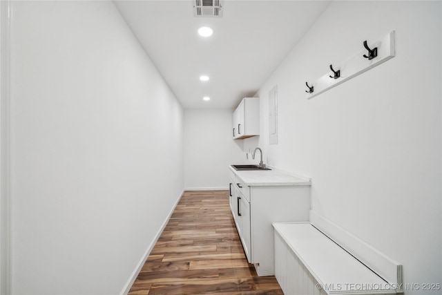 2615 E 59th St, Tulsa, OK 74105 - interior space featuring visible vents, light wood-type flooring, a sink, baseboards, and recessed lighting