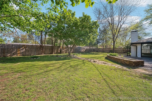 2615 E 59th St, Tulsa, OK 74105 - view of yard featuring a fenced backyard