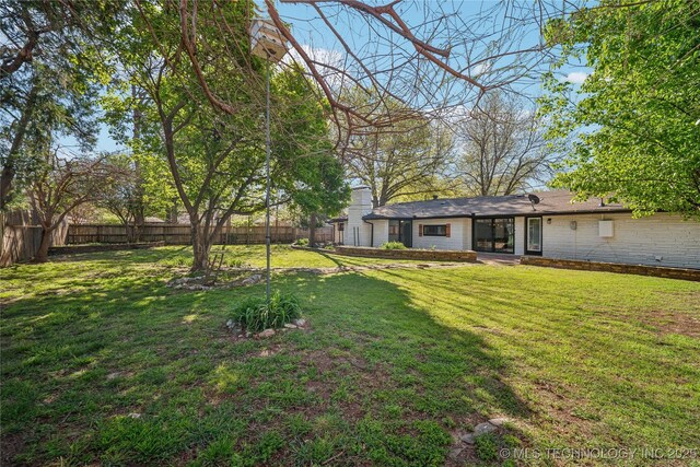2615 E 59th St, Tulsa, OK 74105 - view of yard featuring a fenced backyard