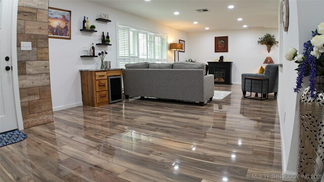 2615 E 59th St, Tulsa, OK 74105 - living area featuring recessed lighting, baseboards, visible vents, and wood finished floors