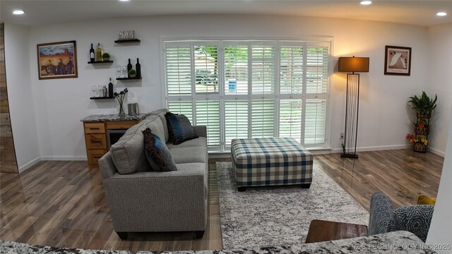 2615 E 59th St, Tulsa, OK 74105 - living area featuring baseboards, recessed lighting, and wood finished floors