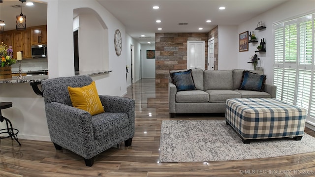 2615 E 59th St, Tulsa, OK 74105 - living area featuring arched walkways, recessed lighting, baseboards, wood finished floors, and visible vents
