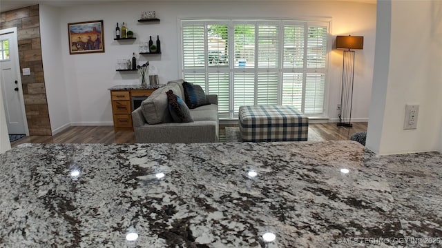 2615 E 59th St, Tulsa, OK 74105 - living area featuring baseboards and wood finished floors