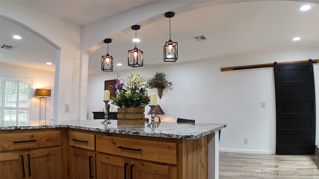 2615 E 59th St, Tulsa, OK 74105 - bar featuring visible vents, light wood-type flooring, recessed lighting, a barn door, and arched walkways