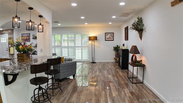 2615 E 59th St, Tulsa, OK 74105 - living room with recessed lighting, baseboards, dark wood-style flooring, and visible vents