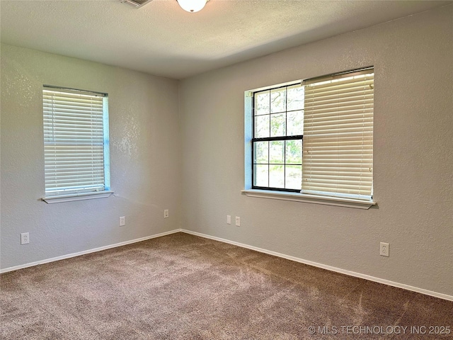 4665 Primrose, Sulphur, OK 73086 - empty room with carpet floors, a textured wall, and baseboards