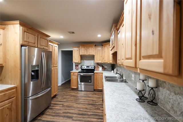 4665 Primrose, Sulphur, OK 73086 - kitchen featuring stainless steel appliances, light countertops, recessed lighting, dark wood-style flooring, and a sink