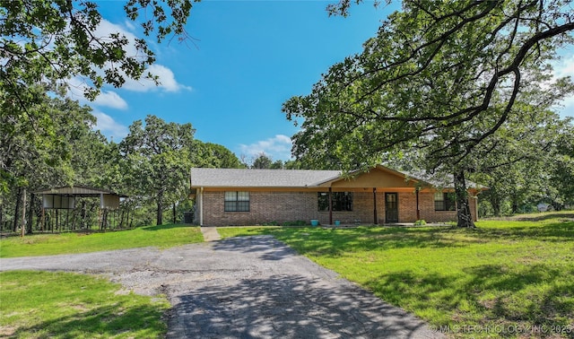 4665 Primrose, Sulphur, OK 73086 - ranch-style house with brick siding and a front yard