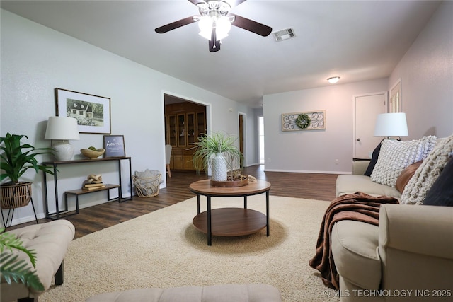 4665 Primrose, Sulphur, OK 73086 - living area with ceiling fan, wood finished floors, and baseboards