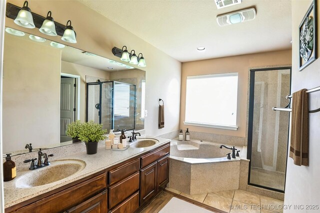 1809 E Montgomery St, Broken Arrow, OK 74012 - bathroom featuring a stall shower, a garden tub, double vanity, and tile patterned floors