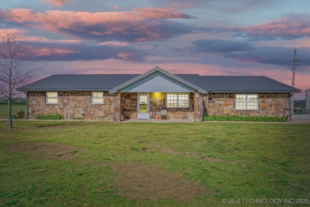 9720 S 4475th Rd, Miami, OK 74354 - ranch-style home featuring a yard, stone siding, and metal roof