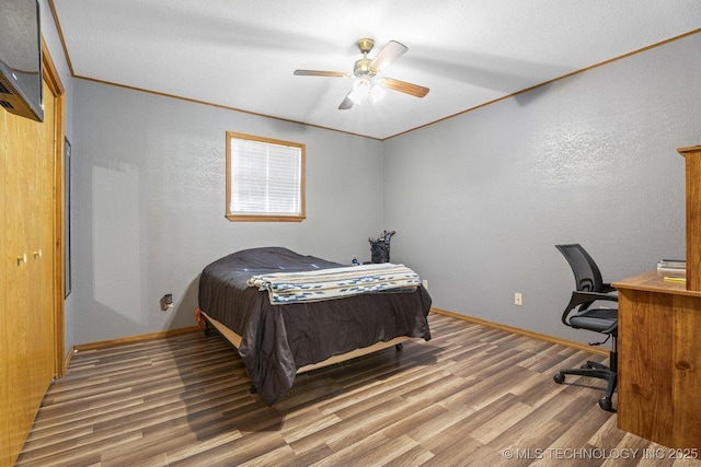 9720 S 4475th Rd, Miami, OK 74354 - bedroom with baseboards, a ceiling fan, and wood finished floors