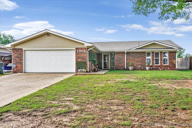 2909 Haddock Dr, Muskogee, OK 74401 - single story home featuring brick siding, an attached garage, fence, and driveway