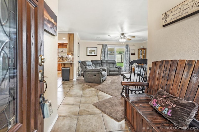 2909 Haddock Dr, Muskogee, OK 74401 - entrance foyer featuring crown molding, light tile patterned floors, and a ceiling fan