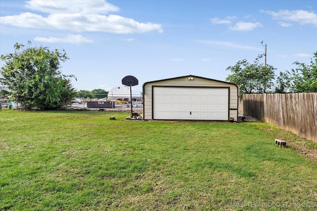2909 Haddock Dr, Muskogee, OK 74401 - view of yard featuring fence, an outbuilding, and a garage