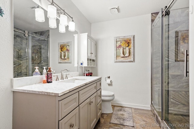 2909 Haddock Dr, Muskogee, OK 74401 - bathroom featuring vanity, stone finish flooring, toilet, and a shower stall