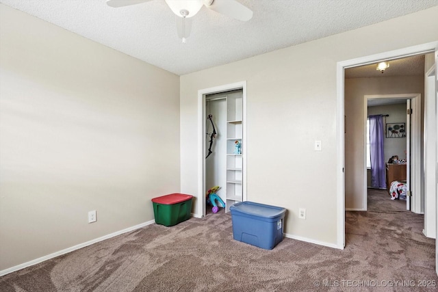 2909 Haddock Dr, Muskogee, OK 74401 - unfurnished bedroom with a textured ceiling, baseboards, and carpet