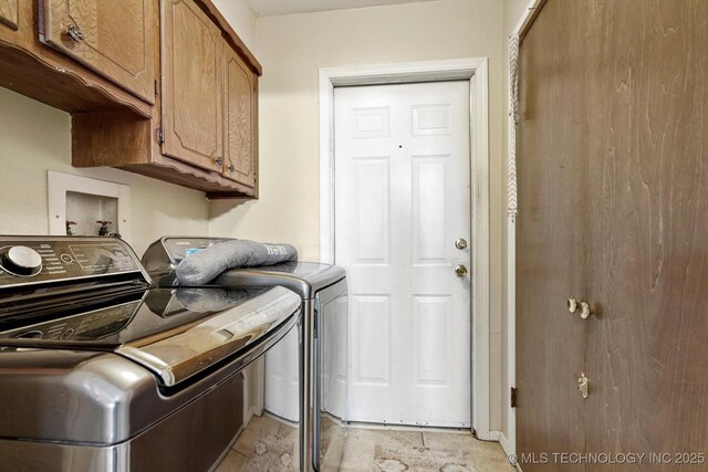 2909 Haddock Dr, Muskogee, OK 74401 - laundry room featuring cabinet space and washing machine and clothes dryer