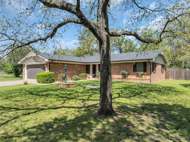 ranch-style home with a garage, a chimney, fence, brick siding, and driveway