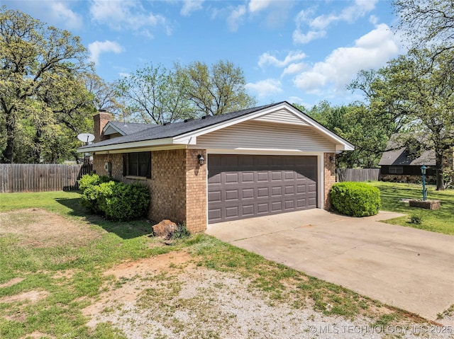 view of front of home with a chimney, a front lawn, an attached garage, brick siding, and fence