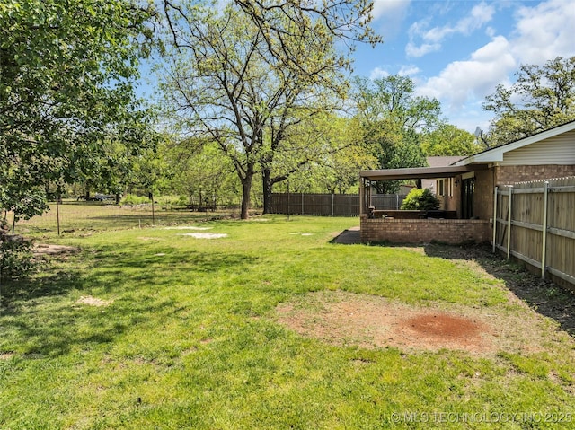 view of yard with a fenced backyard